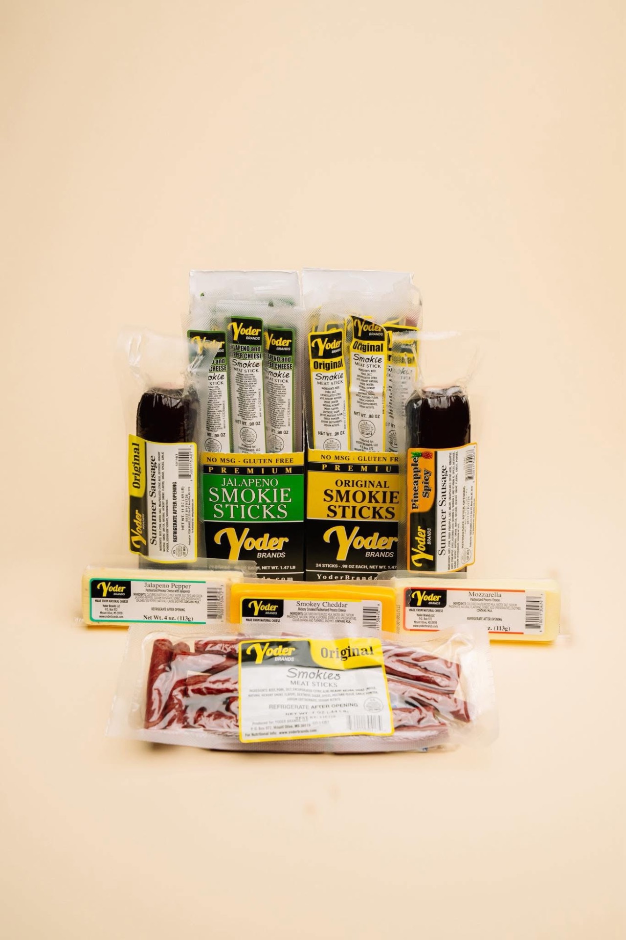 Yoder Brands product lineup including summer sausage, smokie sticks, and cheese